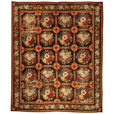 Antique Needlepoint Rug in Brown, Red and Green Floral Pattern.