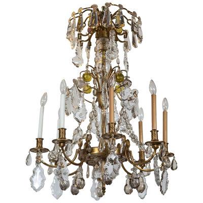 A Finely Cast Bronze and Crystal Eight Arm Chandelier	