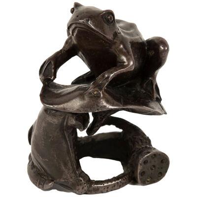 Japanese bronze frog on a water lily