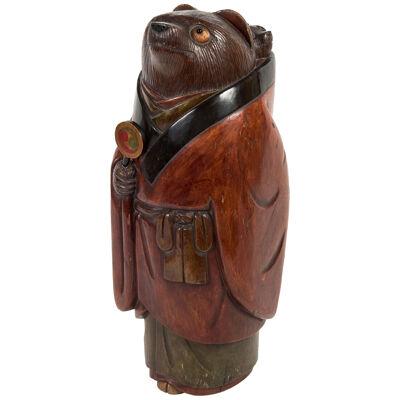 Japanese polychrome lacquered wood sculpture of a tanuki and baby