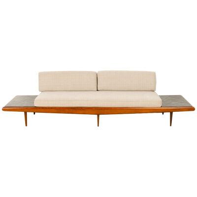 A Mid-Century Modern sofa in the manner of Adrian Pearsall.
