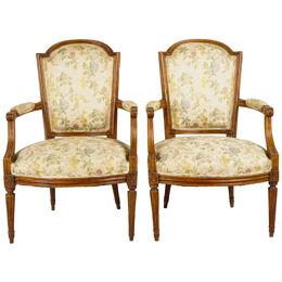PAIR OF LATE 19TH CENTURY FRENCH LOUIS XVI STYLE CARVED WALNUT FAUTEUILS