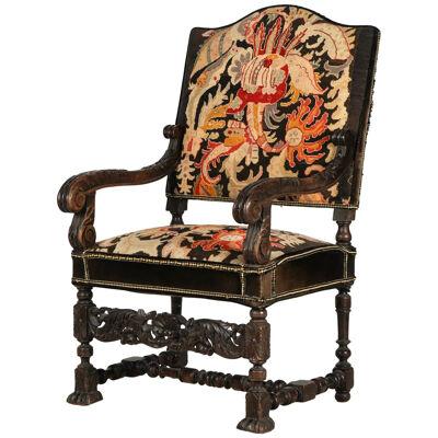 LATE 19 CENTURY SPANISH COLONIAL REVIVAL CARVED ARMCHAIR WITH NEEDLEPOINT 