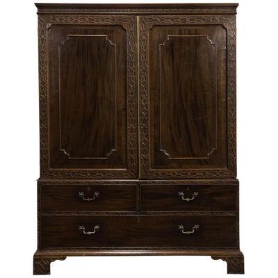 LATE 18THC GEORGE III MAHOGANY LINEN PRESS IN THE CHINESE CHIPPENDALE TASTE