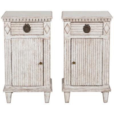 Fancy pair of bedside tables, richly carved, 19th C.