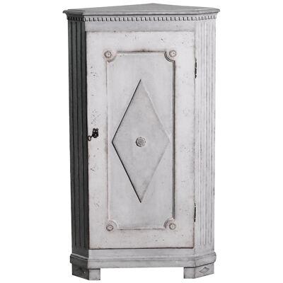 Gustavian corner cabinet with carvings, circa 1810 - 20.