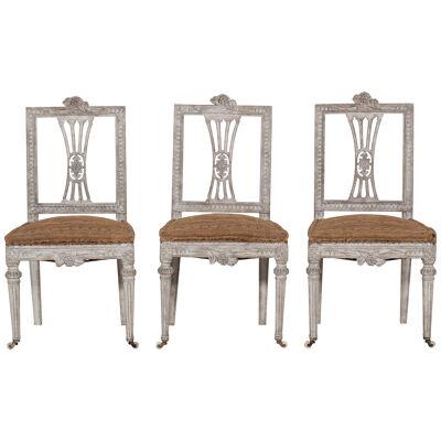 Three richly carved Gustavian side chairs, 18th C.