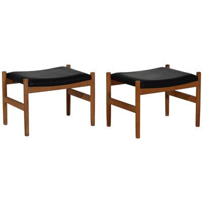 Pair of Danish stools with leather seats, signed, 1960´s.