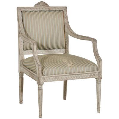 Richly carved Gustavian armchair, early 19th C.