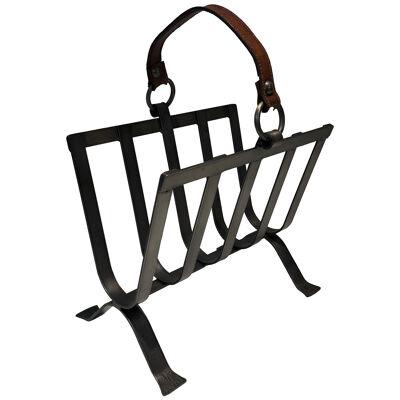 Steel and leather magazine rack. French work in the style of Jacques Adnet. 