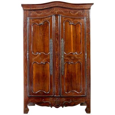 18TH CENTURY CARVED FRENCH YEW AND CHESTNUT ARMOIRE