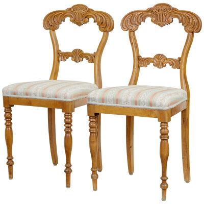 PAIR OF EARLY 20TH CENTURY CARVED BIRCH HALL CHAIRS