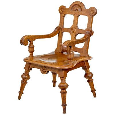 LATE 19TH CENTURY CARVED OAK ARTS AND CRAFTS ARMCHAIR