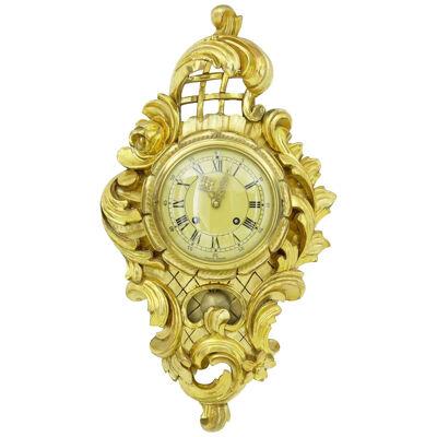 20TH CENTURY CARVED AND GILT ORNATE WALL CLOCK HASSELBLAD MOVEMENT