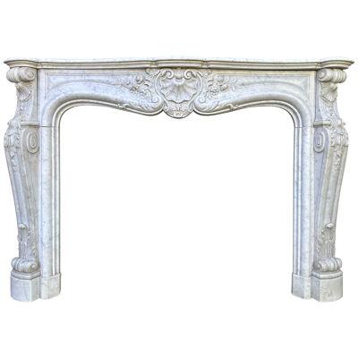 A large Antique Louis XV French Rococo Carved Marble Fireplace Mantel