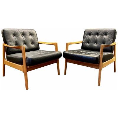 A Pair of Danish Black Leather and Cherry Wood Armchairs