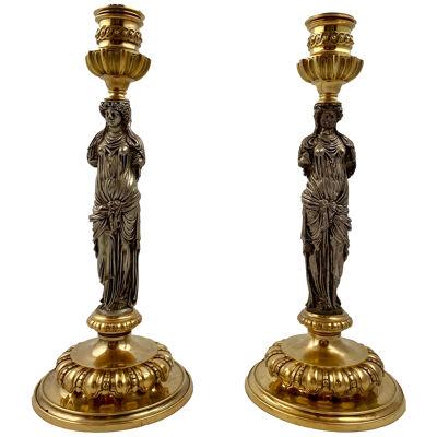 A pair of candlesticks, late 19th c signed Barbedienne.