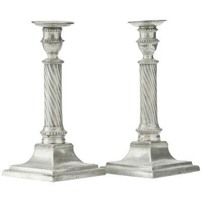 A pair of pewter candlesticks made year 1799.