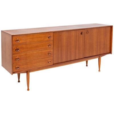 Teak sideboard, with four drawers and two doors. 20th century.