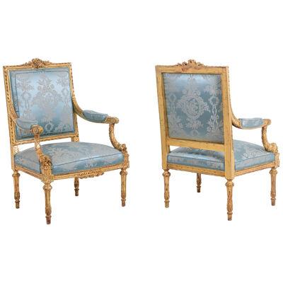 Pair of Louis XVI style armchairs in gilded and carved wood. Circa 1880