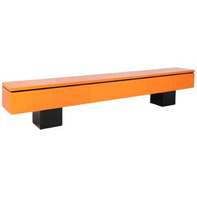 Large sideboard in orange lacquer. Work from the 1960s.