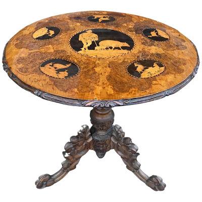 Late 19th-Early 20th Century Carved and Inlaid Black Forest Table with Stags