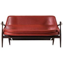 Sofa in Rosewood and Reupholstered in Burgundy Leather by Ib Kofod-Larsen, 1956