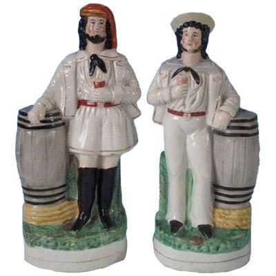 Pair Staffordshire sailor & barrel figures