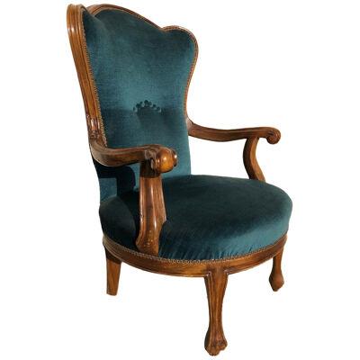 Style 700 armchair in hand-carved walnut wood and padded with hand-tied springs