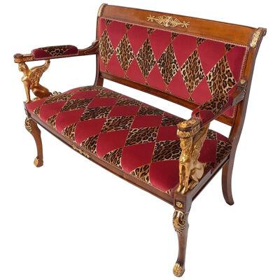 Carved maple sofa decorated in gold leaf 