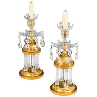 A Pair of George III Temple Candlesticks