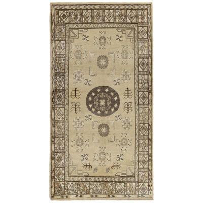 Antique Turkestan Khotan rug in Beige-Brown, White, Medallion Patterns