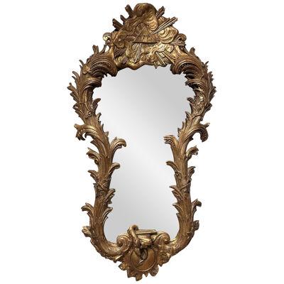 AN UNUSUAL LARGE CARVED GILTWOOD WALL MIRROR
