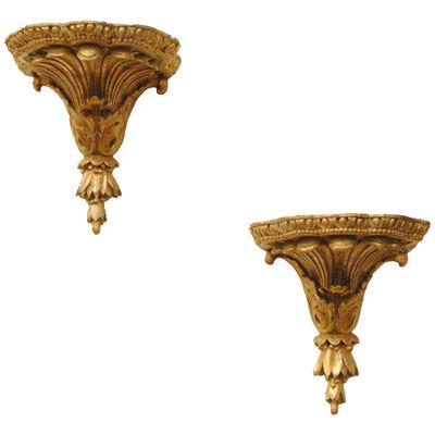A PAIR OF 18TH CENTURY CARVED GILTWOOD WALL BRACKETS
