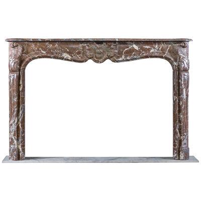 A Rouge Marble Louis XV Chimneypiece