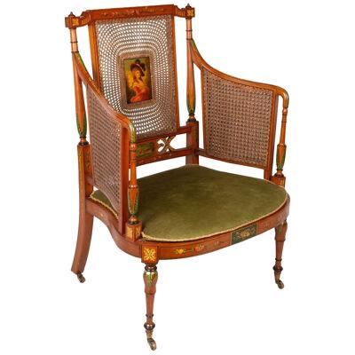 Satinwood Bergere library arm chair, circa 1890