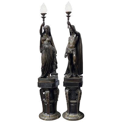 Large pair French mid-19th century gilt and patinated bronze figural torchères
