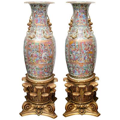 Large pair 19th Century Rose medallion vases on stands.