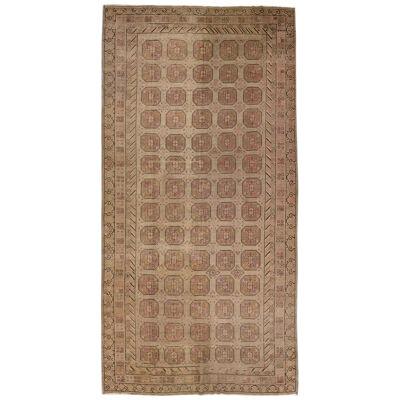 1900s Antique Brown Handmade Khotan Wool Rug with Geometric Pattern