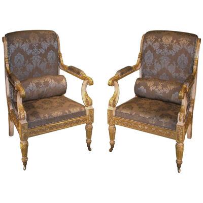 Impressive pair of Regency period white painted and carved giltwood Armchairs.