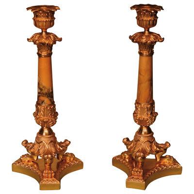 A pair of Regency period ormolu candlesticks