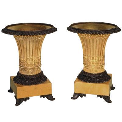 A pair of early 19th Century bronze and ormolu gothic style vase-shaped Tazzas.