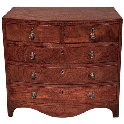 A 19th century miniature bow fronted chest of drawers