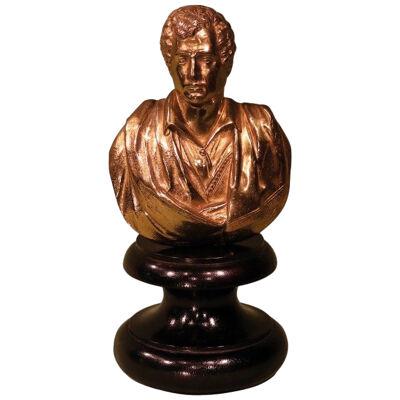 A gilt brass bust of Lord Byron