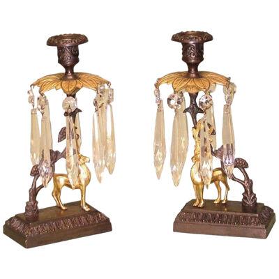A pair of 19th Century bronze and ormolu Stag Lustre Candlesticks.