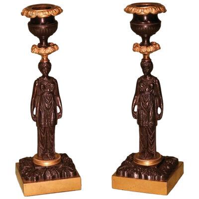 A Pair of 19th Century Regency period bronze & ormolu Lady Candlesticks