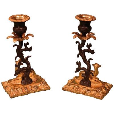 Pair of 19th century bronze and ormolu stag and deer candlesticks	