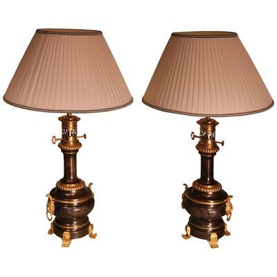 A pair of French 19th century Moderateur Oil Lamps