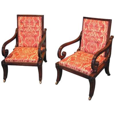 An unusual pair of Regency period mahogany sliding Library Armchairs.