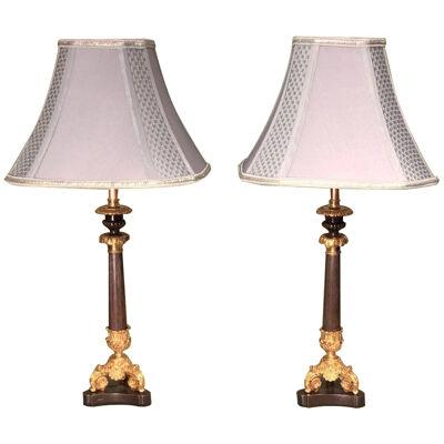 Pair of mid 19th Century Bronze and Ormolu Triform Candlestick Lamps	